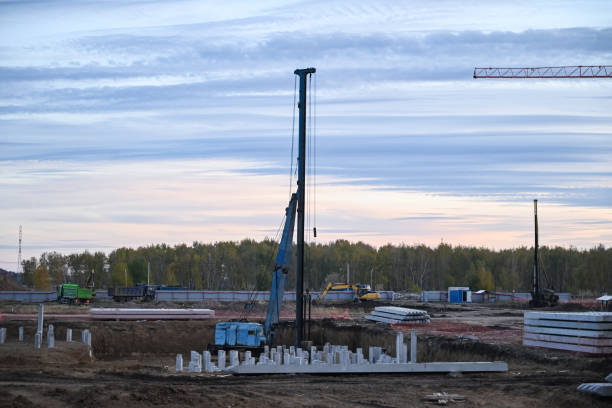 istock Panoramic image of a cluster of construction cranes at the initial stage of construction. Natural light 1443872367