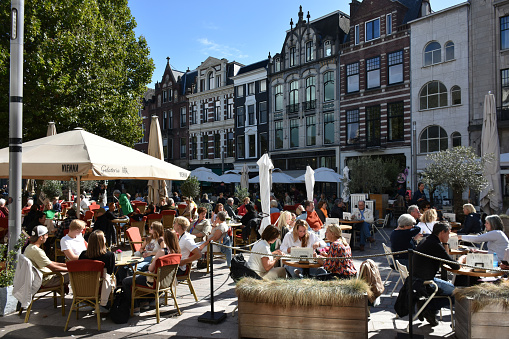 The Hague City Shopping District In South Holland The Netherlands Europe, Advertisement Sign, Retail Store, People Sitting Down, Eating And Drinking In A Restaurant During Summer Season