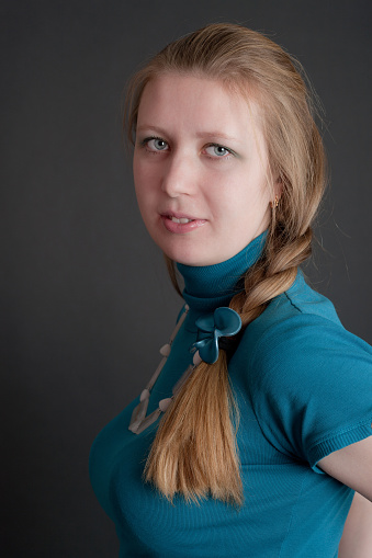 the girl with a fair hair on a black background