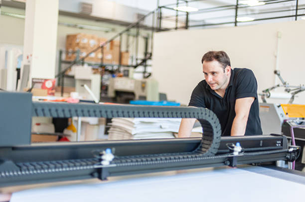 istock Professional worker printmaker technician operator works in modern printing plant 1443882424