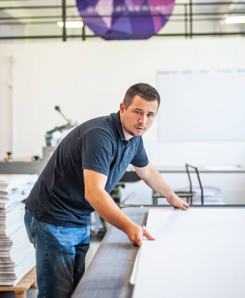 istock Professional worker printmaker technician operator works in modern printing plant 1443884647