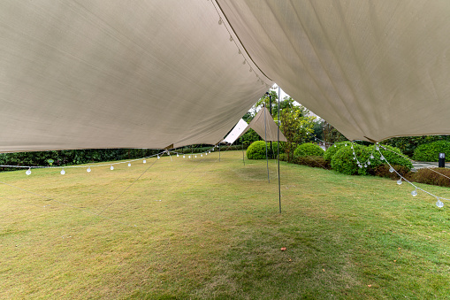 Outdoor simple tent on green grassland