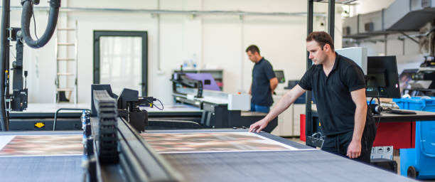 istock Professional worker printmaker technician operator works in modern printing plant 1443885525
