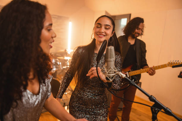istock Happy Diverse Band Singing In A Cosy Recording Studio 1443887091
