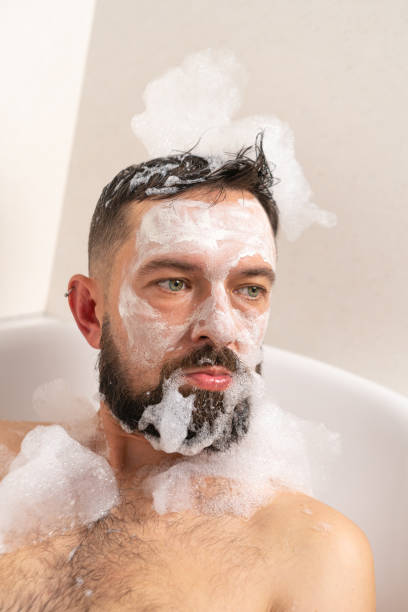 istock Fanny man with face mask in bath at home 1443887197