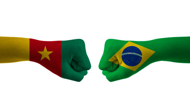 istock Brazil VS Cameroon hand flag Man hands patterned football 1443891567