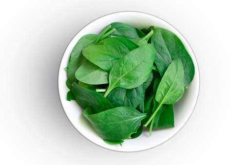 Spinach leaves in a plate isolated