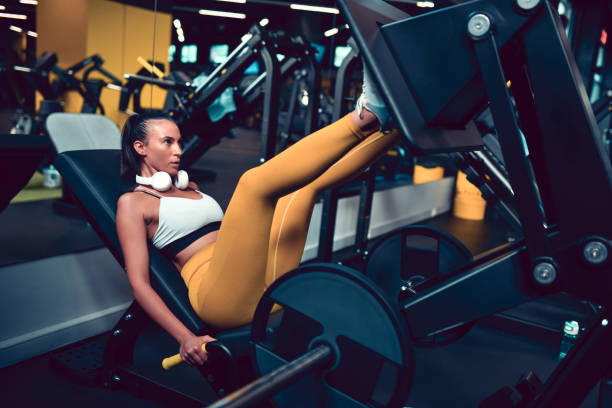 istock Female Athlete Doing Leg Press Exercise In Gym 1443892806