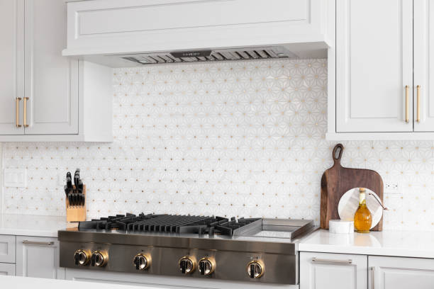 istock A kitchen stove detail in a grey kitchen with a beautiful backsplash. 1443896415