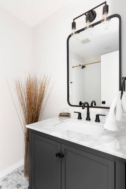 istock A bathroom with a grey cabinet and hexagon tiled floor. 1443896612