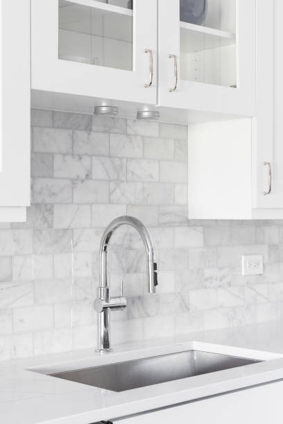 istock A kitchen sink detail shot in a white kitchen. 1443896781