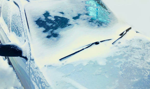istock Close up frozen winter car covered snow, view front window windshield on snowy background 1443897665