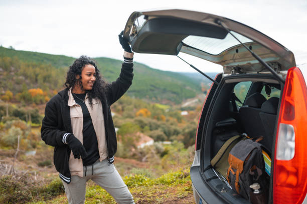 istock Backpacker picking up luggage from car trunk 1443899062