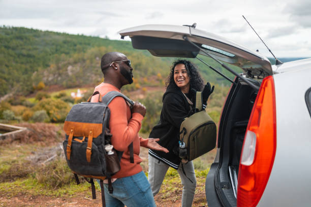 istock Backpackers closing car trunk on mountain tour 1443899398