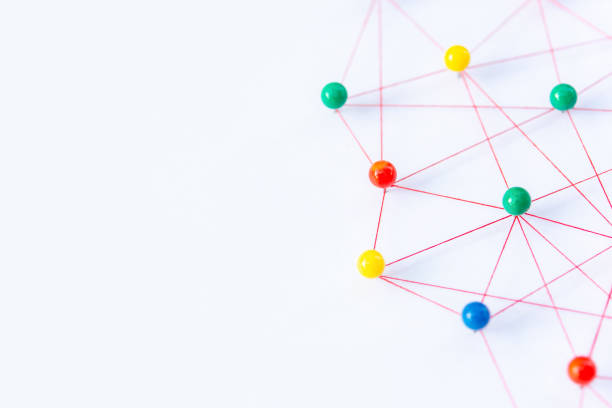 istock Linking entities, Blockchain, social media, Communications Network, The connection between the two networks. Network simulation on paper linked together by yarn 1443901923
