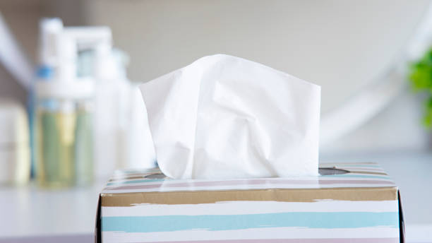 Light color napkin tissue box on white background. Cold and flu concept. stock photo