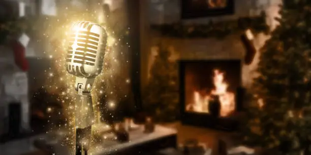 Photo of Karaoke background. Silver vintage microphone on bokeh Christmas tree and news year decoration. Concept Christmas time for web banner , display or montage your products.