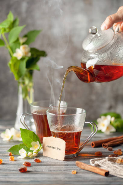 istock Tea with jasmine flowers in glass cup. Ceremony concept. 1443907446