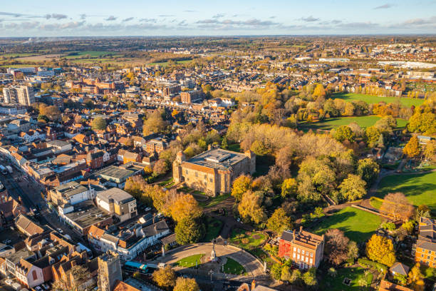 Colchester Castle Aerial photo from a drone of Colchester Castle in Essex, UK. This photo was captured in November 2022. Colchester Castle is a Norman castle in Colchester, Essex, England, dating from the second half of the eleventh century. The keep of the castle is mostly intact and is the largest example of its kind anywhere in Europe, due to its being built on the foundations of the Roman Temple of Claudius, Colchester. norman uk tree sunlight stock pictures, royalty-free photos & images