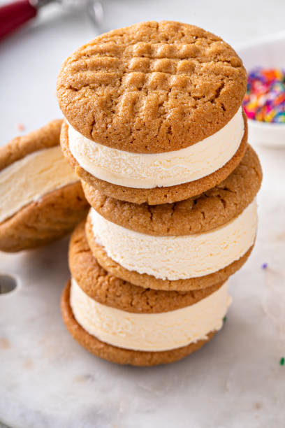 istock Ice cream and cookies sandwiches stacked on the table 1443907849