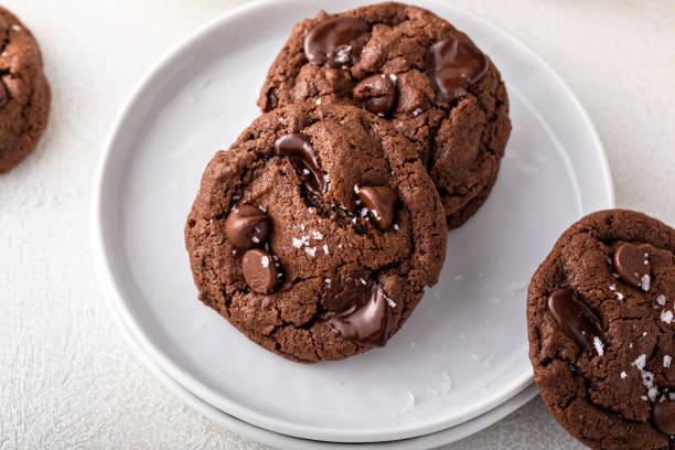istock Double chocolate cookies with dark chocolate chips and salt flakes 1443907910