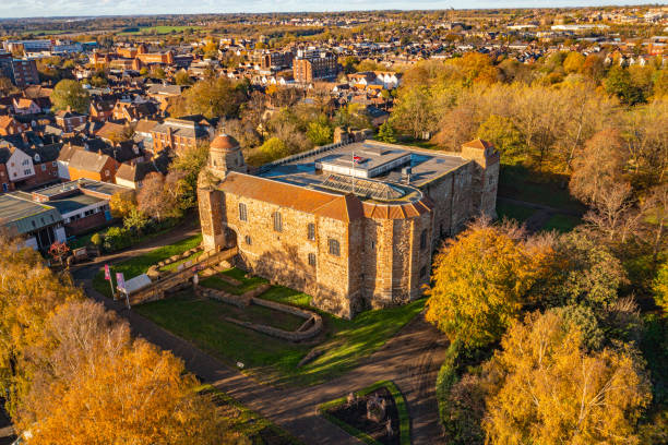 Colchester Castle Aerial photo from a drone of Colchester Castle in Essex, UK. This photo was captured in November 2022. Colchester Castle is a Norman castle in Colchester, Essex, England, dating from the second half of the eleventh century. The keep of the castle is mostly intact and is the largest example of its kind anywhere in Europe, due to its being built on the foundations of the Roman Temple of Claudius, Colchester. norman uk tree sunlight stock pictures, royalty-free photos & images