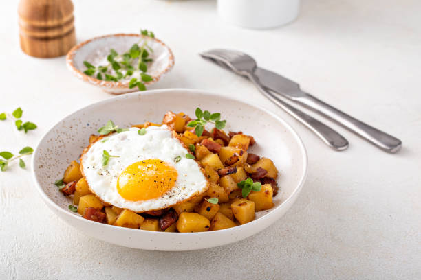 Potato, onion and ham hash topped with fried egg