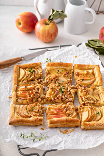 istock Apple tart with puff pastry tpped with walnuts and brown sugar 1443907979