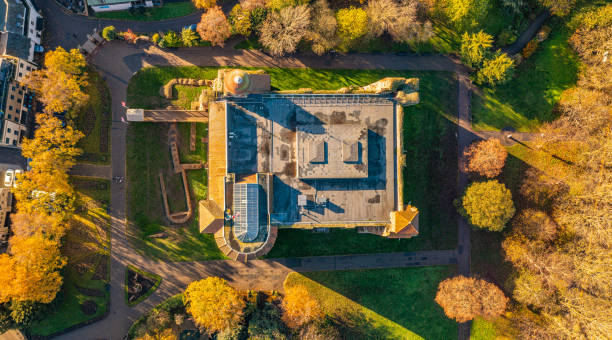 Colchester Castle Aerial photo from a drone of Colchester Castle in Essex, UK. This photo was captured in November 2022. Colchester Castle is a Norman castle in Colchester, Essex, England, dating from the second half of the eleventh century. The keep of the castle is mostly intact and is the largest example of its kind anywhere in Europe, due to its being built on the foundations of the Roman Temple of Claudius, Colchester. norman uk tree sunlight stock pictures, royalty-free photos & images