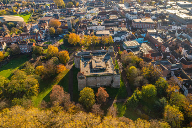 Colchester Castle Aerial photo from a drone of Colchester Castle in Essex, UK. This photo was captured in November 2022. Colchester Castle is a Norman castle in Colchester, Essex, England, dating from the second half of the eleventh century. The keep of the castle is mostly intact and is the largest example of its kind anywhere in Europe, due to its being built on the foundations of the Roman Temple of Claudius, Colchester. norman uk tree sunlight stock pictures, royalty-free photos & images