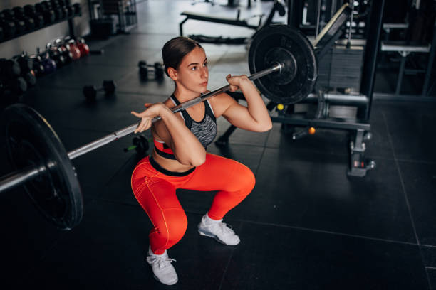 istock Fit woman training with weights 1443915178