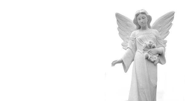 porcelain angel on grayscale bokeh background and copy space