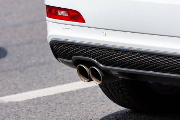 istock Double exhaust pipe of a white car 1443917991