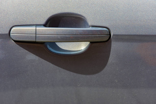 istock Close up to a metallic gray car door handle 1443918144