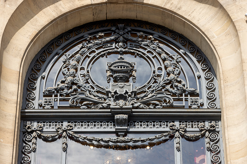 architectural detail of the tower of the Chamber of Commerce in the French city of Lille on the Place du Théâtre. The building was built between 1910 and 1921 and was designed by architect Louis Marie Cordonnier; Lille, France