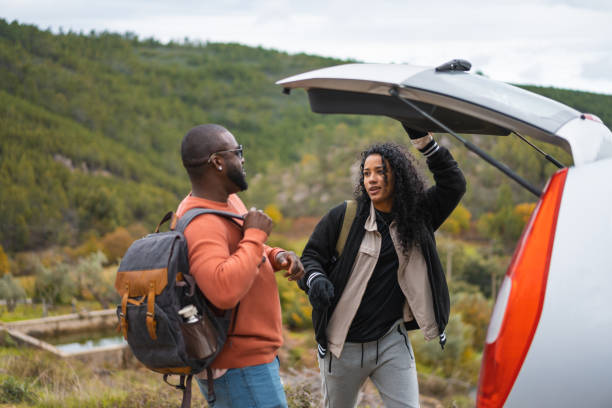 istock Backpackers closing car trunk on mountain tour 1443919852