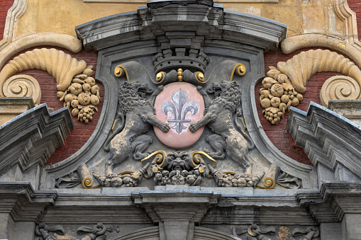 coat of arms of the city of Lille in Northern France on the facade of an old building; Lille, France