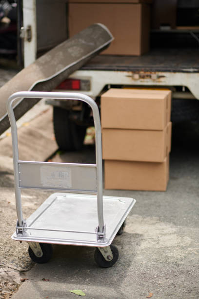 istock Moving Cart next to Van 1443927861