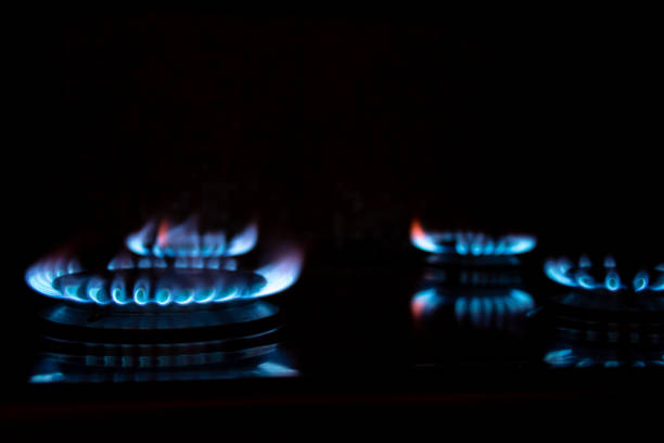 istock Burning gas burners on a black background 1443929958