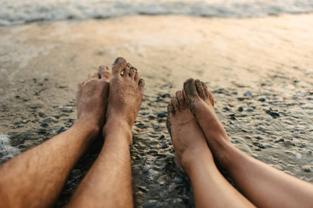 istock Feet by the sea 1443937950