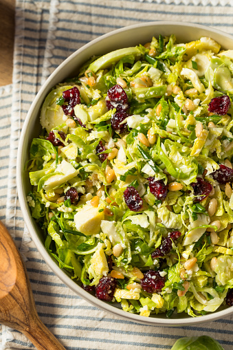Homemade Brussel Sprout Salad with Cranberry Nuts and Cheese