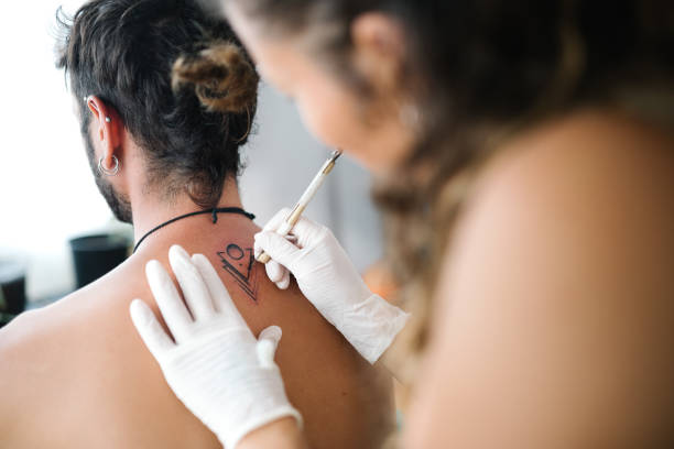istock Handpoke tattoo technique minimalist design 1443939183