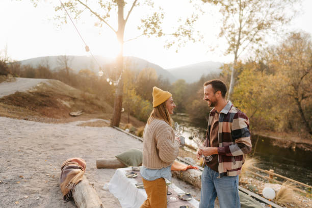 istock Arranging a table for an outdoor dinner party 1443940205