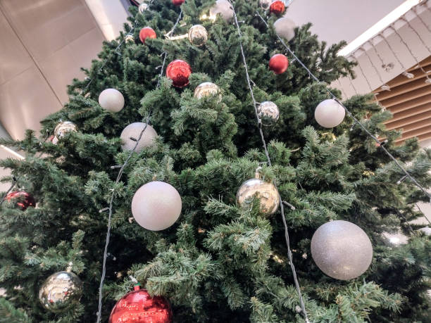 istock Chrstimas tree with globes and lights 1443940290