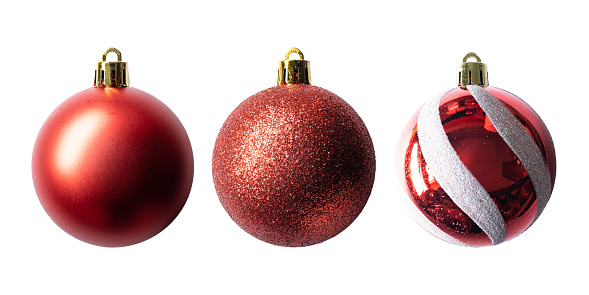 Assortment of Christmas ornaments from the 1930’s on a white background.