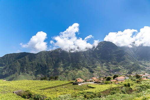 View from the top of a village in a valley in Madeira on a sunny day.