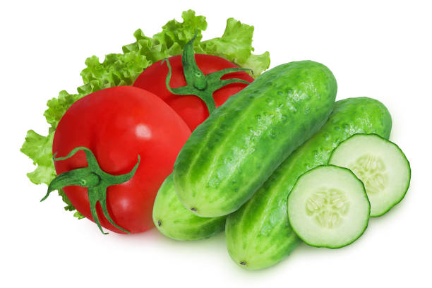 istock Tomatoes and cucumbers on an isolated white background. 1443945778