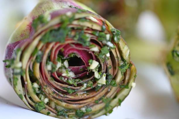 Delicious artichoke to eat with garlic ready to eat stock photo