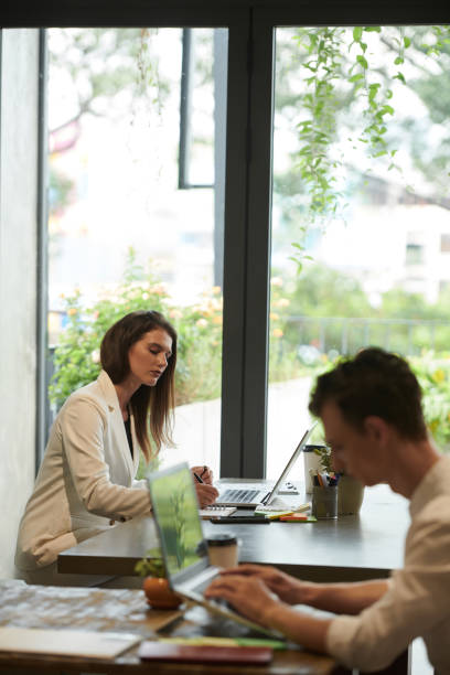 istock Businesswoman Working at Cafe Table 1443947593