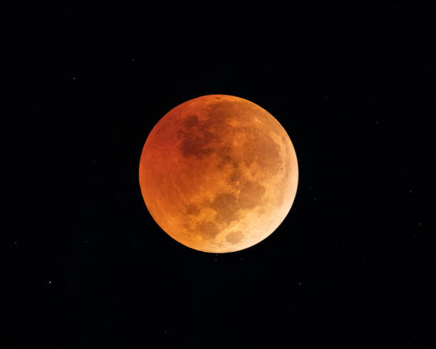 Low angle view of Blood Moon during a Lunar Eclipse stock photo